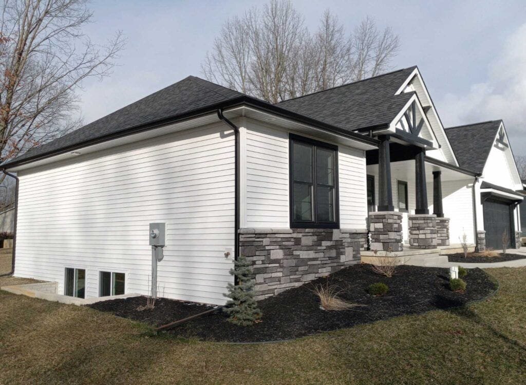 A multi-view image displaying the professional installation of vinyl house siding onto a residential building facade with external thermal insulation.