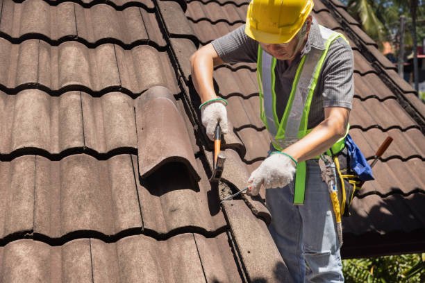 Roofing contractors performing roof replacement in South Bend, IN, with tools and materials displayed on a residential job site.
