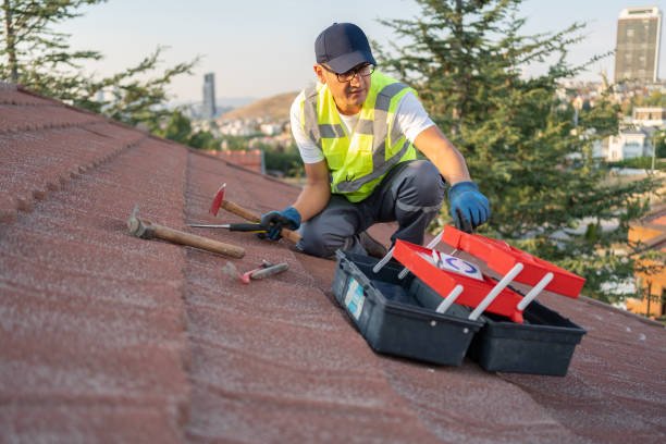 Individual operating a power tool to clean a window, showcasing a practical approach to home maintenance tasks, similar to those provided by roof repair services in Goshen IN