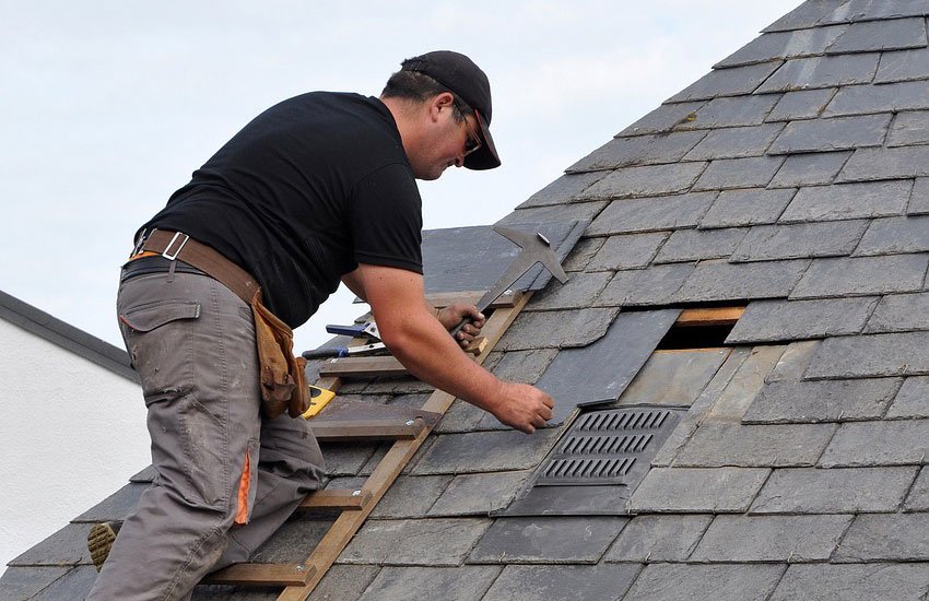 Roofing services contractor at work