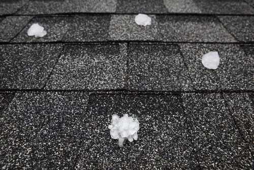 damaged roof flashing identified during roof inspection after a hailstorm