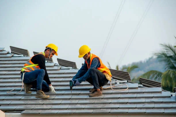 professional commercial roofing contractor inspecting HVAC roof units